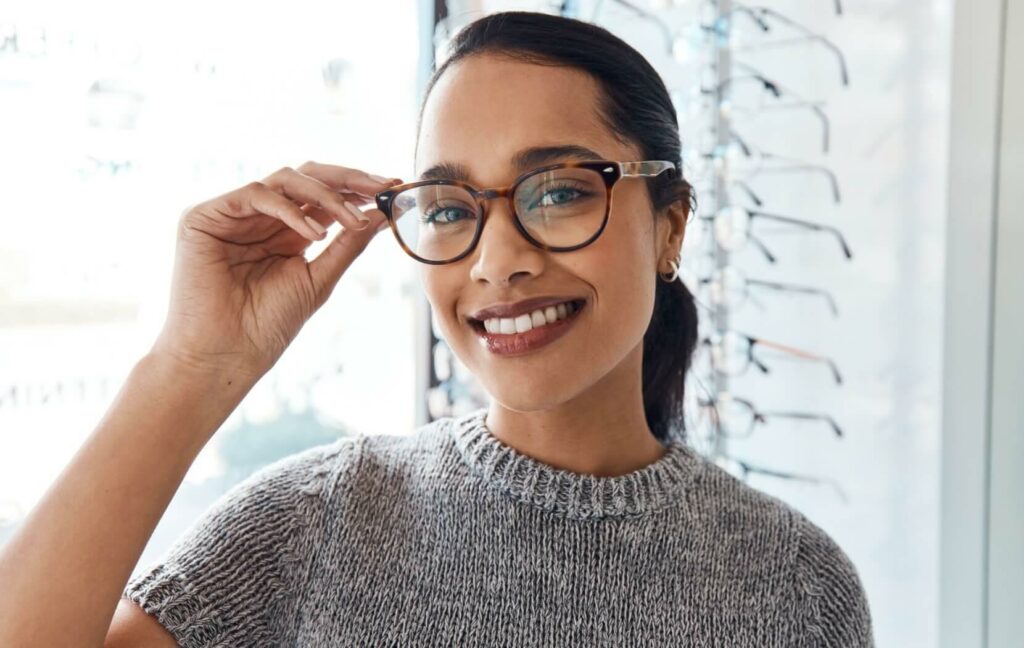a person wearing a pair of trendy glasses