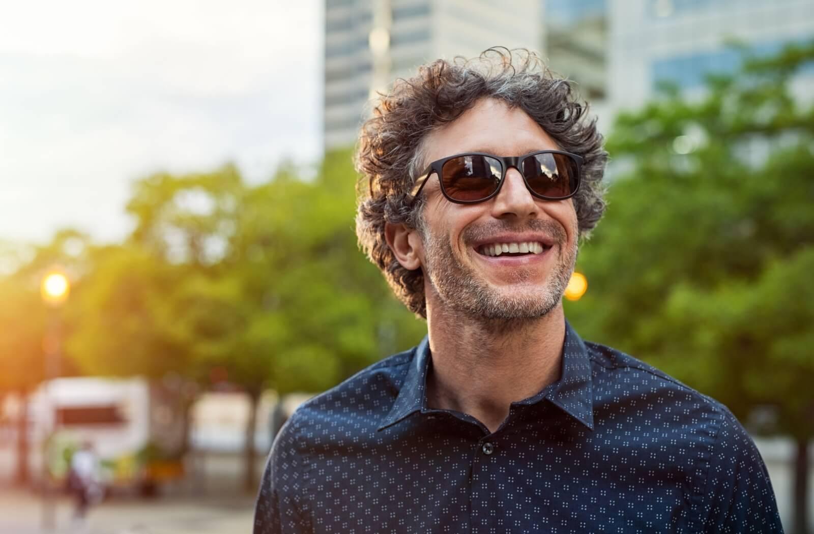 a person wearing sunglasses while outside